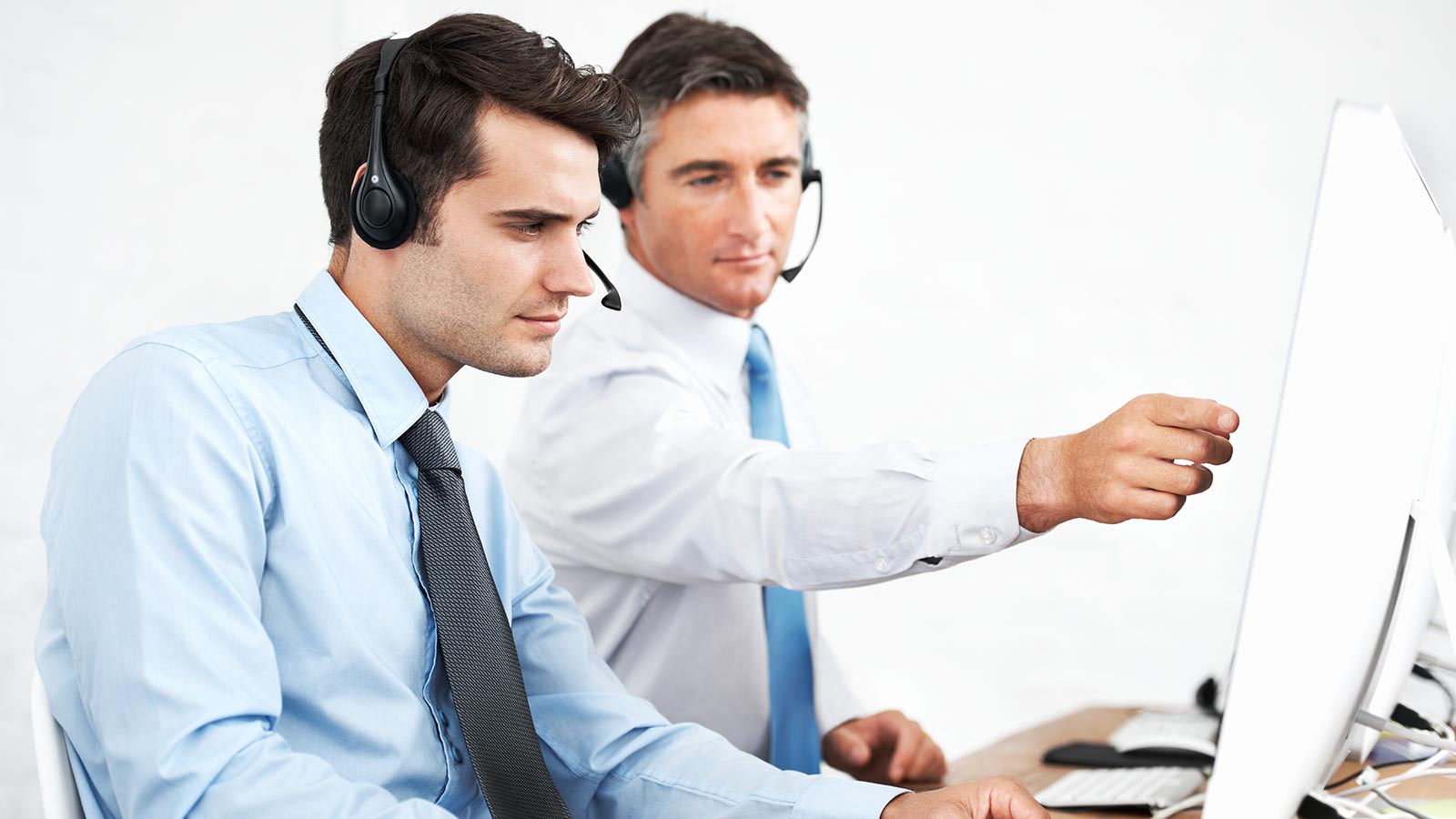 Customer service team working together at support desks
